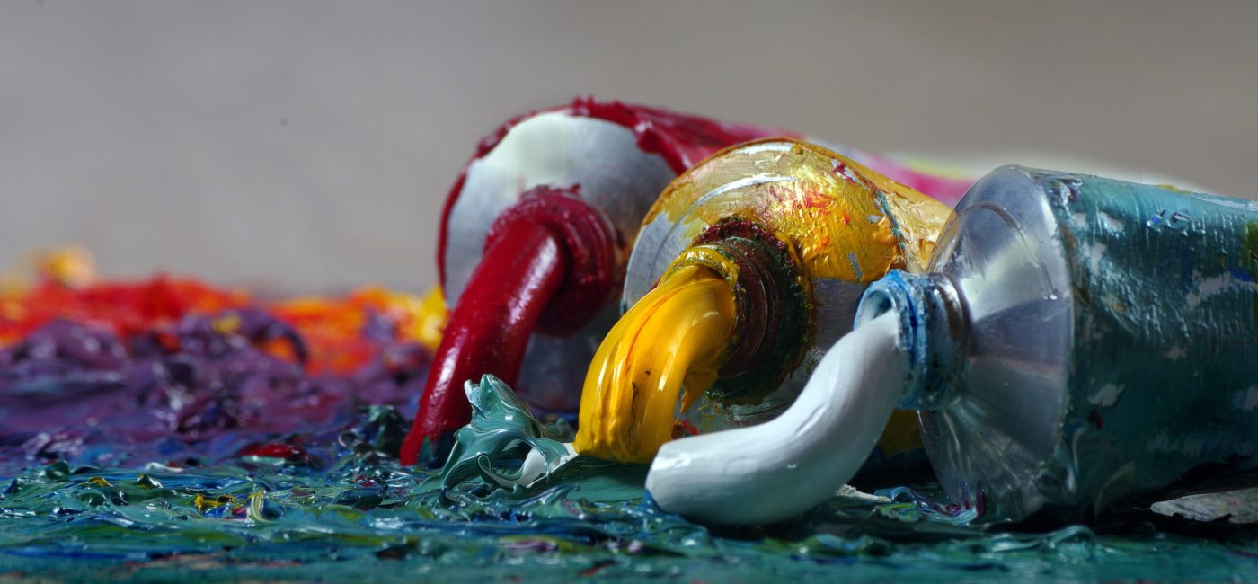tubes with art oil paint on a palette. colorful art paints close