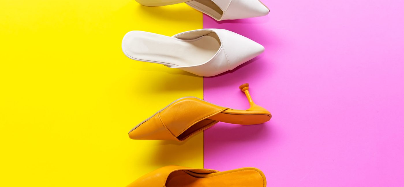 Top View. Fashion shoe woman accessories set. Trendy color full fashion shoes heels. Pink and blue pastel color background and copy space. Fashion Concept.